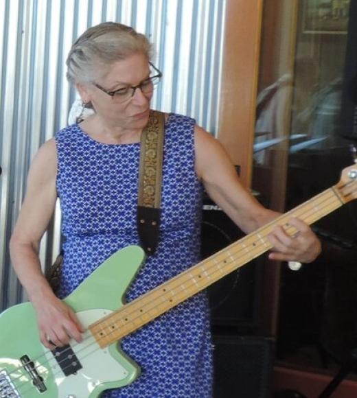 Woman playing the bass guitar
