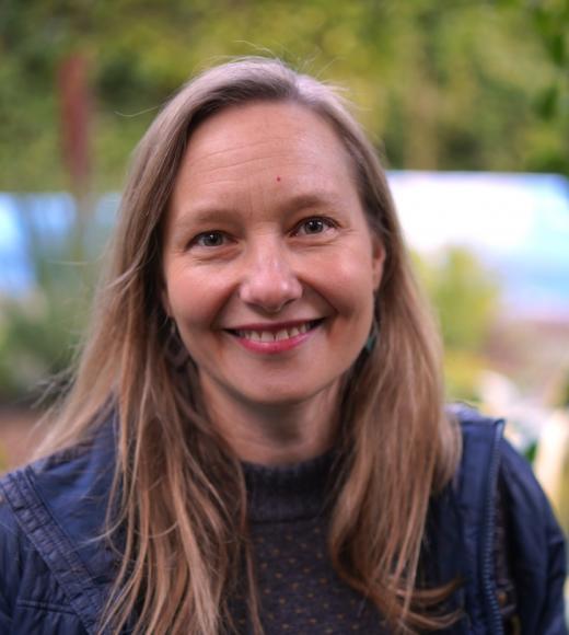 Portrait of a woman in a blue blouse with a blurred background